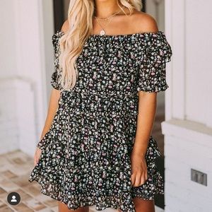These three black floral ruffled dress